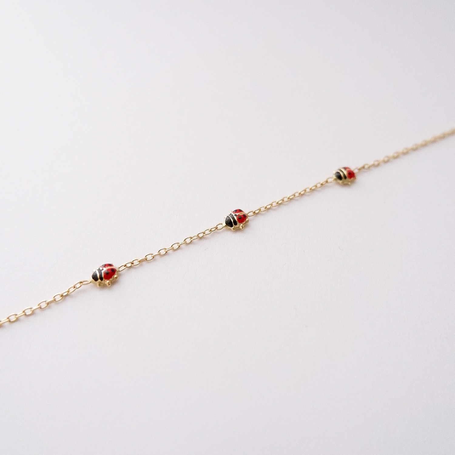 Bracciale Bimba Coccinelle in oro 18kt e smalto colorato