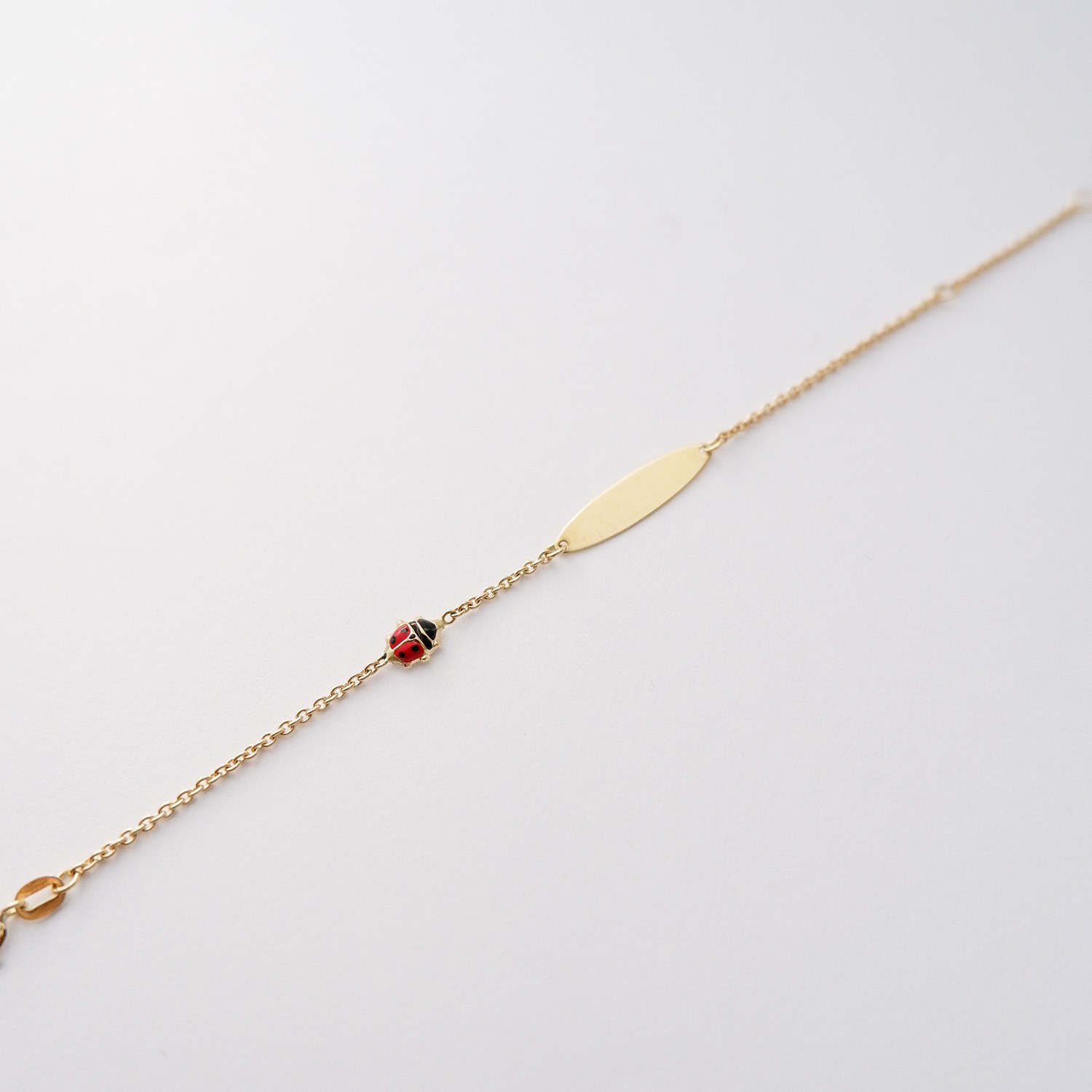 Bracciale Bimba Targhetta con Coccinella in oro 18kt e smalto colorato