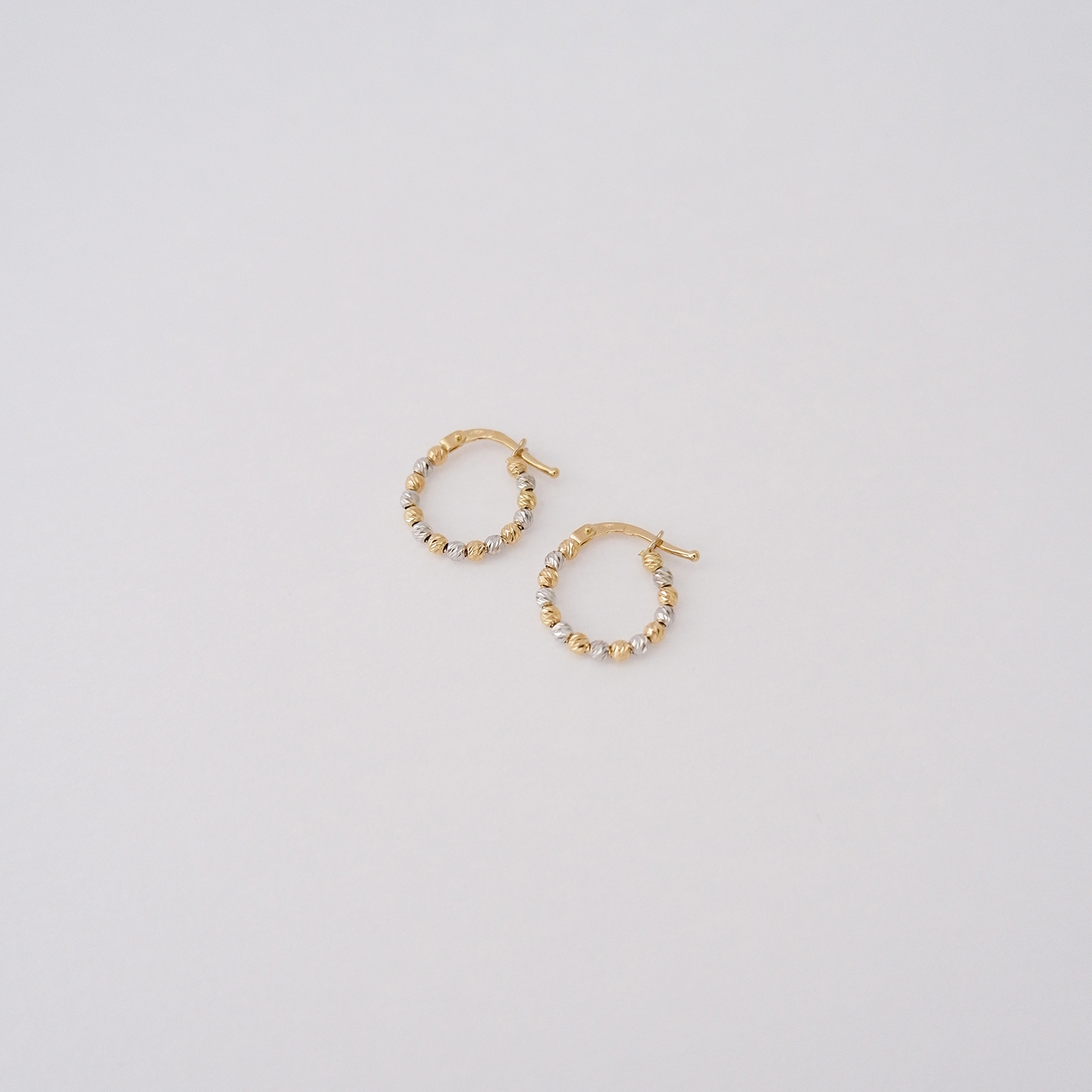 Orecchini a cerchio in oro 18kt – Mini Sfere Diamantate Bicolor